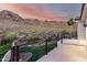 Backyard with a lush green lawn and a mountain view, complemented by a patio at 2326 E Gardenia Dr, Phoenix, AZ 85020