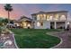 Expansive backyard featuring lush green lawn, covered patio, and desert landscaping at 2326 E Gardenia Dr, Phoenix, AZ 85020