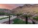 Beautiful backyard landscaping with green grass, desert plants, and mountain views at 2326 E Gardenia Dr, Phoenix, AZ 85020