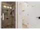 Updated bathroom with a glass door shower showcasing modern fixtures and neutral tile at 2326 E Gardenia Dr, Phoenix, AZ 85020