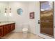 Well-lit bathroom with stylish decor, a custom vanity, and a modern toilet at 2326 E Gardenia Dr, Phoenix, AZ 85020