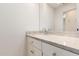 Bright bathroom vanity with a stone countertop, undermount sink, and chrome faucet at 2326 E Gardenia Dr, Phoenix, AZ 85020