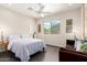Comfortable bedroom featuring a large window with mountain views and a queen sized bed at 2326 E Gardenia Dr, Phoenix, AZ 85020