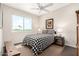 Inviting bedroom with a black and white patterned comforter, side tables and natural light at 2326 E Gardenia Dr, Phoenix, AZ 85020