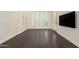 Large bonus room featuring hardwood floors, a media wall, and many windows at 2326 E Gardenia Dr, Phoenix, AZ 85020