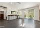 Bright and spacious bonus room with a wet bar and a sliding glass door to the balcony at 2326 E Gardenia Dr, Phoenix, AZ 85020