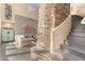 Inviting entryway with stone accents, wooden flooring, and a view into the living area, creating a warm and stylish welcome at 2326 E Gardenia Dr, Phoenix, AZ 85020