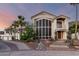 Elegant two-story home features a beautiful front yard, desert landscaping, and stylish architectural details at 2326 E Gardenia Dr, Phoenix, AZ 85020