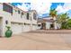Spacious three-car garage home with desert landscaping, palm trees, and a charming entrance at 2326 E Gardenia Dr, Phoenix, AZ 85020