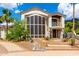 Elegant two-story home features a beautiful front yard, desert landscaping, and stylish architectural details at 2326 E Gardenia Dr, Phoenix, AZ 85020
