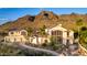 An attractive home showcases mature landscaping, an extended driveway, and custom entry at 2326 E Gardenia Dr, Phoenix, AZ 85020