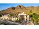 View of this home's eye-catching design, desert landscaping and mountain backdrop at 2326 E Gardenia Dr, Phoenix, AZ 85020
