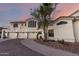 Elegant home exterior features a circular driveway, three-car garage, and desert landscaping at 2326 E Gardenia Dr, Phoenix, AZ 85020