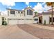 Beautiful home with a three-car garage, desert landscaping, and mature trees under a bright sky at 2326 E Gardenia Dr, Phoenix, AZ 85020
