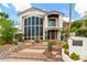 Elegant two-story home features a beautiful front yard, desert landscaping, and stylish architectural details at 2326 E Gardenia Dr, Phoenix, AZ 85020