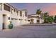 Exterior of a two-story home boasts a three-car garage, balcony, and desert landscaping at 2326 E Gardenia Dr, Phoenix, AZ 85020