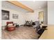 Bright home gym featuring wood floors, exercise equipment, and a leather ottoman at 2326 E Gardenia Dr, Phoenix, AZ 85020