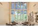 Elegant living room featuring high windows with mountain views, comfortable seating arrangements, and stylish decor at 2326 E Gardenia Dr, Phoenix, AZ 85020
