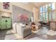 Spacious living room boasts soaring windows, comfortable seating, a unique color palette, and stylish decor, perfect for entertaining at 2326 E Gardenia Dr, Phoenix, AZ 85020