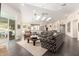 Bright, open living room with dark wood floors and large windows overlooking the backyard and pool at 2326 E Gardenia Dr, Phoenix, AZ 85020