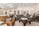 Comfortable living room featuring a patterned couch, skylights, and open kitchen with bar seating at 2326 E Gardenia Dr, Phoenix, AZ 85020