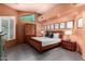 Relaxing main bedroom featuring a king bed, stylish decor, and wood-look floors at 2326 E Gardenia Dr, Phoenix, AZ 85020
