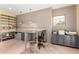 Well-organized office featuring multiple desks, built-in storage, and natural lighting, ideal for a home office or study at 2326 E Gardenia Dr, Phoenix, AZ 85020