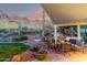 Inviting backyard patio featuring lush desert landscaping, waterfall feature, and tranquil mountain views at 2326 E Gardenia Dr, Phoenix, AZ 85020