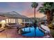 Beautiful backyard pool with lush landscaping, waterfall feature, and serene mountain views at 2326 E Gardenia Dr, Phoenix, AZ 85020