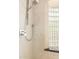 Shower with glass block window and chrome fixtures at 2326 E Gardenia Dr, Phoenix, AZ 85020