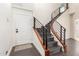 Entryway featuring a modern staircase with dark wood steps and a black metal railing at 2326 E Gardenia Dr, Phoenix, AZ 85020