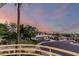 Scenic neighborhood views from a balcony with wrought iron railings at sunset at 2326 E Gardenia Dr, Phoenix, AZ 85020
