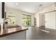 Light-filled wet bar area with stone countertops, cabinets, and sliding glass door at 2326 E Gardenia Dr, Phoenix, AZ 85020