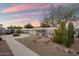Backyard with desert landscaping and fire pit, offering scenic views at 2487 S Conestoga Rd, Apache Junction, AZ 85119