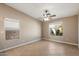 Spacious bedroom featuring tile floors, neutral paint, and an inviting window with desert views at 2487 S Conestoga Rd, Apache Junction, AZ 85119