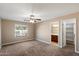 Comfortable bedroom with a ceiling fan, a scenic window view, and access to a bathroom and closet at 2487 S Conestoga Rd, Apache Junction, AZ 85119