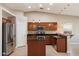 Well-equipped kitchen featuring granite counters, stainless steel appliances, and a functional island at 2487 S Conestoga Rd, Apache Junction, AZ 85119