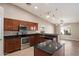 Modern kitchen with granite countertops, stainless steel appliances, and ample cabinet space at 2487 S Conestoga Rd, Apache Junction, AZ 85119