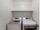This laundry room has a newer washer and dryer at 2487 S Conestoga Rd, Apache Junction, AZ 85119