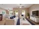 Inviting living room with stylish white furniture, tile floors, and modern decor at 2487 S Conestoga Rd, Apache Junction, AZ 85119