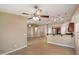 Open concept living room with tile flooring, recessed lighting, breakfast bar and stainless steel appliances at 2487 S Conestoga Rd, Apache Junction, AZ 85119