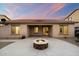 Back patio with a built-in fire pit perfect for entertaining at 2487 S Conestoga Rd, Apache Junction, AZ 85119