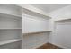 Walk-in closet featuring ample shelving and hanging storage, ideal for organizing clothes and accessories at 2487 S Conestoga Rd, Apache Junction, AZ 85119