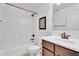 Cozy bathroom featuring a single sink vanity and a shower-tub combination with white tiles at 24886 W Huntington Dr, Buckeye, AZ 85326