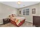 The bedroom includes a cozy bed with carpet flooring and neutral-colored walls, offering a comfortable retreat at 24886 W Huntington Dr, Buckeye, AZ 85326