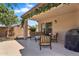 Inviting covered patio with a grill, perfect for outdoor dining and relaxing with a view at 24886 W Huntington Dr, Buckeye, AZ 85326