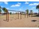 Set of swings in a well maintained community park with views of homes at 24886 W Huntington Dr, Buckeye, AZ 85326