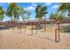 Swings under trees offering recreational activities for all at 24886 W Huntington Dr, Buckeye, AZ 85326