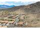 An aerial view of a community with mountain views and several homes with private pools at 2722 W Hiddenview Dr, Phoenix, AZ 85045