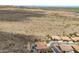An aerial view showcasing a desert landscape with custom homes, some featuring private pools at 2722 W Hiddenview Dr, Phoenix, AZ 85045